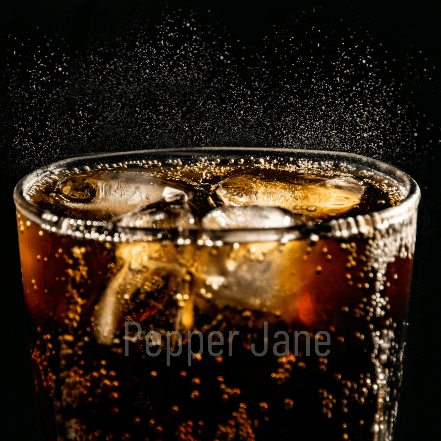 Glass of bubbly dark soda representing fizzy pepper soda fragrance oil.